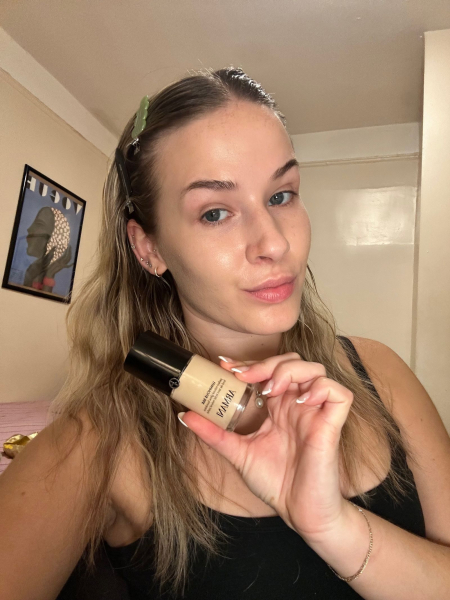 Image may contain Cosmetics Bottle Perfume Adult Person Brown Hair and Hair